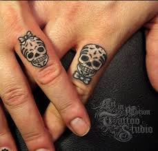 Pin By Shaina Gregory On Tattoo Skull Couple Tattoo Ring Finger Tattoos Finger Tattoo Designs