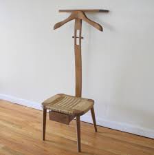 Although valet stands are generally associated with hanging up men's suits, they are perfect for any gender. Mid Century Modern Valet Picked Vintage