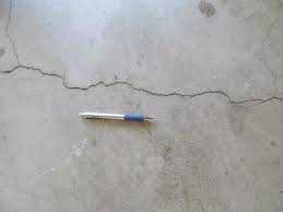 Hairline concrete cracks can be. Cracks In A Concrete Garage Floor When Are They Serious Buyers Ask