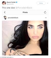 Aaron Carter holds hands with Porcelain Black