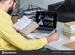 Bearded Man Studying Book Laptop Charts Graphs Screen Modern