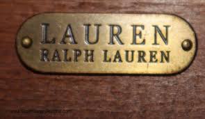 An arched doorway opens to a chic, beige dining room filled with a ceiling medallion accented with a white faux bois chandelier illuminating an extra large round dining table, ralph lauren william & mary gateleg table lined with 10 beige dining chairs, restoration hardware 1940s french barrelback fabric side chairs surrounded by walls clad in beige wallpaper, farrow & ball acanthus wallpaper. Sold Price Ralph Lauren Oval Mahogany Dining Room Table With Custom Glass Top And 1 Leaf Invalid Date Edt