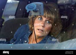 Cindy Anthony, wife of George Anthony, leaves the Anthony family home