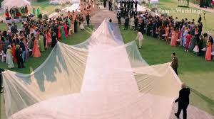 See Priyanka Chopra S 75 Foot Veil As She Walks Down The Aisle To Marry Nick Jonas People Com watch priyanka chopra s dramatic walk down the aisle to marry nick jonas