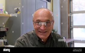 Rob Kuipers, a 70-year-old retired senior civil servant who is the chairman  of the local food bank in Leidschendam-Voorburg, within easy cycling  distance of the parliament in The Hague, talks with the