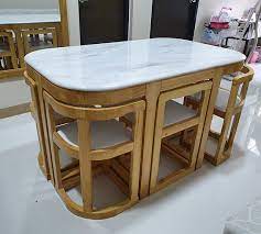 This dining table with 4 straight legs contemporary styling features clean, simple lines to match any decor crafted from durable asian solid woods. Philippines Entertainment These Space Saving Dining Tables Are Perfect For Small Condos Under One Ceiling Your Source Of News Information In Dubai Uae Philippines And International Ofw Expats