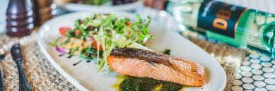 The restaurant has a seating area with tables. Hoxton Brasserie Liverpool Catholic Club