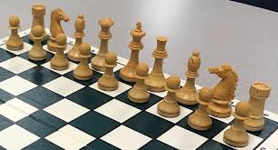 The pawns are simply small wooden blocks, with each of the larger pieces representing its function through its cut. Rejected Game Variant For Adding A New Chess Piece Chess Stack Exchange