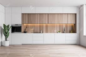 Interior Of Minimalist Kitchen With White Walls Wooden Floor Stock Photo Picture And Royalty Free Image Image 127359407