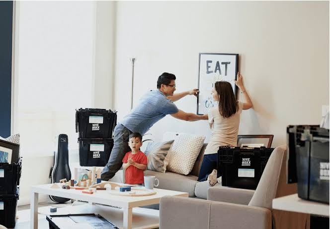 Relaxed family settling into a new home after an organised move