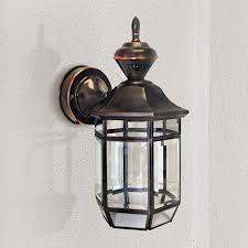 Several uk homeowners now make use of led outdoor wall lights with dusk to dawn sensors in a few different methods for the home exterior. Antique Copper 13 1 2 Dusk To Dawn Motion Sensor Wall Light 35153 Lamps Plus