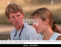 STAMPS 2/19OCT94/SP/MACOR Julia Stamps 15 year old sophomore at Santa Rosa  High School, the holder of several national age-group records in running.  With her personal coach Dan Aldridge. Chronicle Photo: Michael Macor (