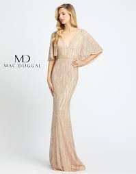 Born in india, designer mac duggal's enthusiasm for women's couture fashion was honed at an early age when he began to merge the rich, royal history and opulent traditions of his native land with a sophisticated and contemporary design esthetic. Mac Duggal 4917d North Beach Boutique