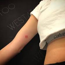 Red Ink Rose Tattoo On The Right Inner Arm In 2021 Tattoos Tattoos For Women Rose Tattoos For Women