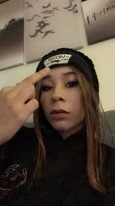 Can some help me fix this picture remove hand, maybe change his clothes ,  center him please and thank you