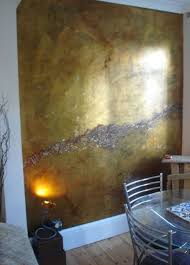 Home Design And Decor Interior Metallic Paint Wall Dining Room With Gold Metallic Paint Wall And Hardwood Floor Metallic Paint Walls Gold Walls Decor