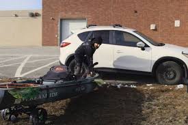 Position the kayak in your truck bed. How To Load Unload Kayak On Suv By Yourself Using Only A Blanket Railblaza