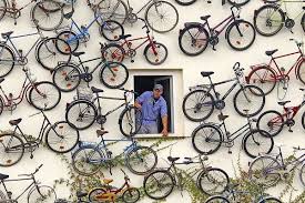 German Bike Shop Decorated With 120 Bicycles Stuck To Its Storefront Gift Ideas Creative Spotting In 2020 Shop Facade Bicycle Store Fronts