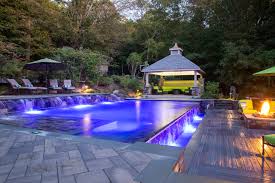 award winning swimming pool with negative edge waterfall and fire pit building a pool swimming pools pool award winning swimming pool with