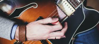 Gently put your index finger and thumb together then close your other three fingers toward your palm. How To Hold A Guitar Pick Properly Tips And Tricks
