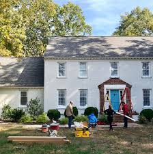 Taking cues from this house, you can paint the base of your villa a bluish white; Painting Our Brick House White Young House Love