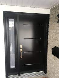 A properly installed steel front door is a reliable protection against burglars or thieves. Steel Vog Entry Door With Full Sidelite In Black Entry Doors Black Entry Doors Steel Doors