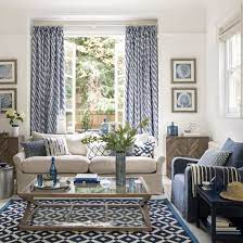 Mediterranean Inspired Living Room A Statement Feature Wall Or Eye Catching Curtains Mediterranean Living Rooms Blue Living Room Blue And White Living Room