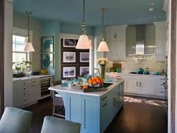 Nothing feels as tranquil as a sunny day under a clear blue sky or gazing out at a shimmering blue ocean. Eat In Coastal Kitchen With White Cabinets And Blue Island Hgtv