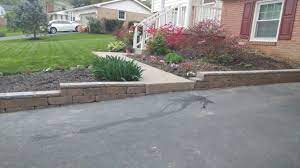 Diy Retaining Wall Along Driveway Done In One Weekend Yard Stones Front Yard Stone Wall Front Yard Landscaping