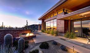 Custom home builder for central texas, primarily austin with a focus on modern home design and building. Adobe Walls And Sleek Overhangs Enthrall At Damon Residence