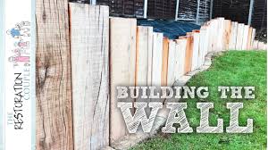 We did this by digging out a trench to create a solid level surface on which we placed railway sleepers. Oak Garden Wall 3 0 Construction Youtube