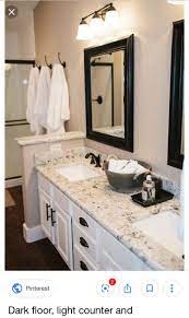 If you are unable to book a sink top, we do not recommend installing your vanity or booking your contractor until you have received all items needed to complete the install. Off White Vanity With Light Countertop Dark Trim Around The Mirror And Dark Fixture Modern Bathroom Cabinets Bathroom Remodel Master Farmhouse Master Bathroom