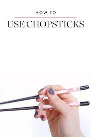 How To Hold Chopsticks So You Don T Look Totally Clueless How To Hold Chopsticks Chopsticks How To Store Potatoes