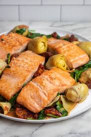 One Pan Salmon With Artichokes And Sundried Tomatoes Giadzy Recipe In 2020 Sun Dried Tomato Salmon Recipes Salmon Dinner