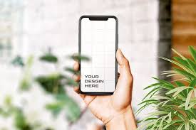 Download Download Hand Holding New Smartphone Mockup Surrounded By Leaves For Free In 2020 Iphone Mockup Phone Mockup Social Media Design Inspiration