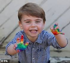 Prince Louis is dressed in his father Prince William's signature navy  jumper and blue shirt