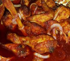 The dish starts with making crispy fried chicken which is finished in a curry tomato sauce. Dapur Cik Puan Berasap Ayam Masak Merah