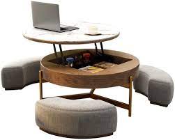 Ottoman coffee tables are cool and pretty easy to work with, especially if you like casual decors because no matter how much you try you could never make a both coffee tables and ottomans come in a variety of different shapes. Amazon Com Creative Round Coffee Table And Liftable Desk Tempered Glass Table Top With 3 Combined Stools For Living Room And Office Kitchen Dining