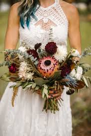 Brides can choose white bridal bouquets for weddings that are contemporary or victorian, formal or casual. Flowers By Lace And Lilies White Burgundy Blue Bouquet With Pink Protea Dahlia Thistle Magn Wedding Bouquets Flower Bouquet Wedding Wedding Bouquets Pink