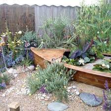 Beach themed decorating to transform your outdoor space into a seaside retreat. Image Result For Beach Themed Garden Beach Theme Garden Seaside Garden Beach Gardens