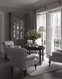The upstairs landing was transformed into a small den that makes an inviting, casual family hangout. Dove Gray Home Decor Great Tufted Chairs French Country Decorating Living Room French Country Living Room Country Living Room