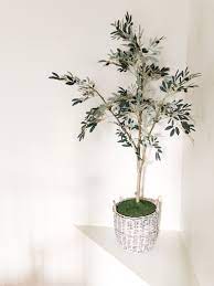 The artificial bonsai potted plant in a pot gives your room oriental charm. How To Pot Your Faux Trees Bower Power