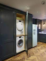 Ever thought about turning your cupboard into a laundry space? A Compact Alternative To A Separate Utility Room The Bank Of Tall Utility Cupboards In Our Holkham Ki Laundry Cupboard Utility Room Storage Laundry In Kitchen
