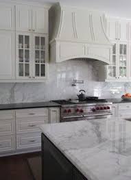 Black And White Marble Kitchen Countertops Honed Black Granite Counter At Stove Marble Island White Marble Countertops Kitchen Remodel Countertops Black Granite Countertops