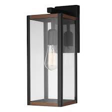 Elegantly elevating exterior spaces, the fathom led outdoor wall sconce by modern forms features a textural glass panel that instantly makes a statement. Globe Electric Bowery 1 Light Outdoor Indoor Wall Sconce Matte Black Faux Wood Accents The Home Depot Canada