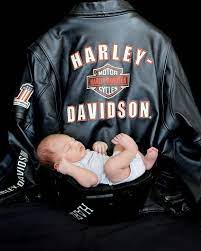 Harley Davidson Baby In Daddy S Helmet With Daddy S Jacket In Background Harley Newborn Biker Baby Harley Baby