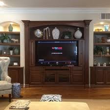 This living room idea revolves around the calming effect of light blue hues, both in terms of its wall color and in terms of its furniture choices. 50 Best Home Entertainment Center Ideas