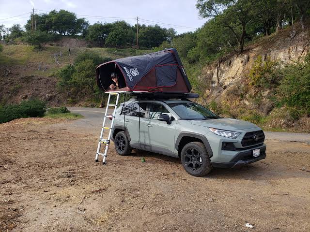 Compact 4x4 Toyota RAV4 with single rooftop tent for budget self-drive safari in Kigali.