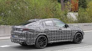 New Bmw X6 M Looks Menacing In First Spy Shots Bmw X6 Bmw New Bmw