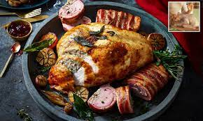 Transfer the turkey to a board, cover loosely with foil and rest for about 20min before carving. M S Creates A Foolproof Turkey Which Comes Pre Stuffed And Basted With De Boned Thighs Daily Mail Online
